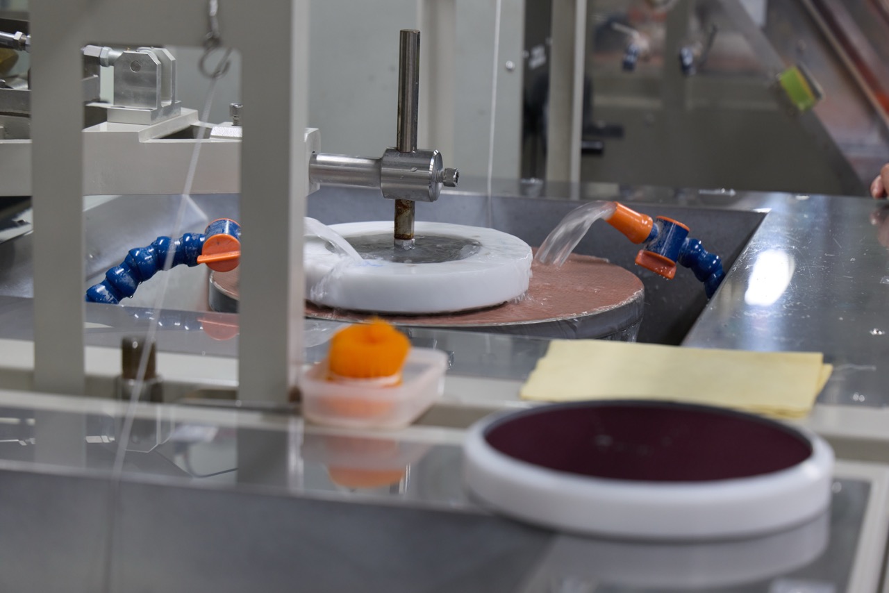 A piece of factory equipment used for making lenses.